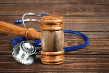 a gavel and a stethoscope